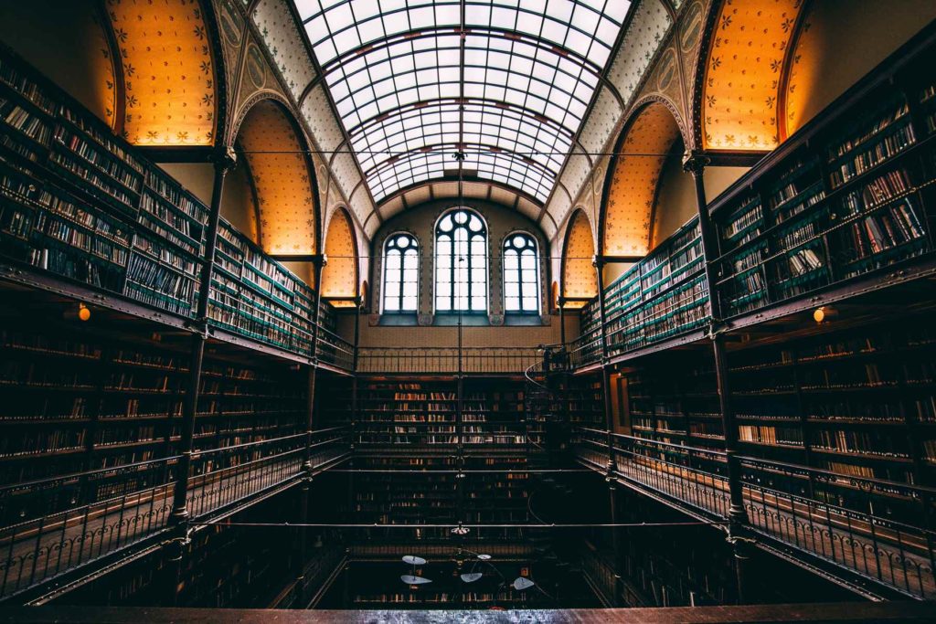PhD thesis library. Photo by Will van Wingerden on Unsplash